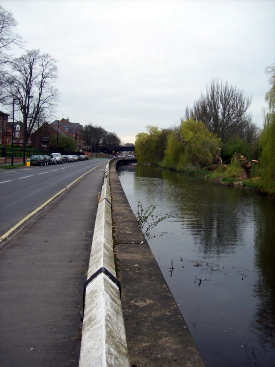 a white barrier on the side of a road