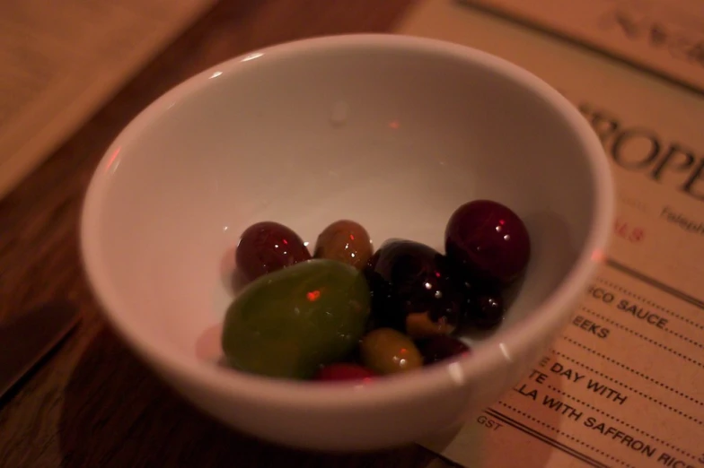 a white bowl with some fruit in it