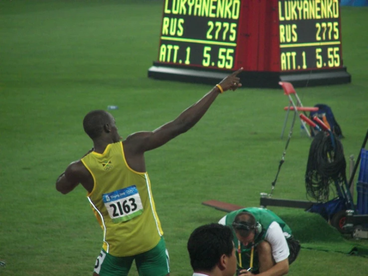 a professional athlete raising his hand in victory