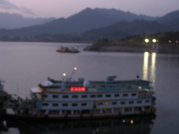 an aerial view of a large boat docked on the water