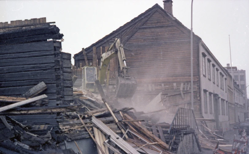 a very messy city with wooden buildings and junk