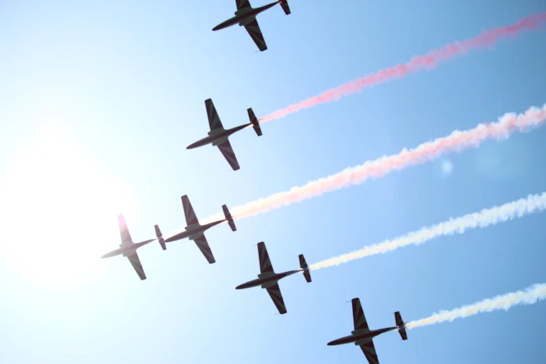 an image of four jets that are flying