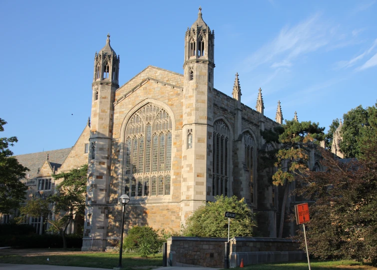 a gothic style church with tall towers and windows