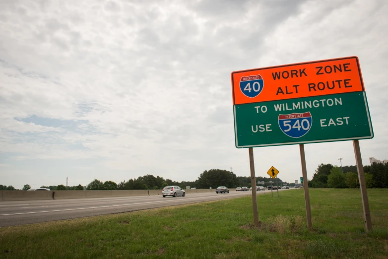 there are two signs for the highway with the highway names