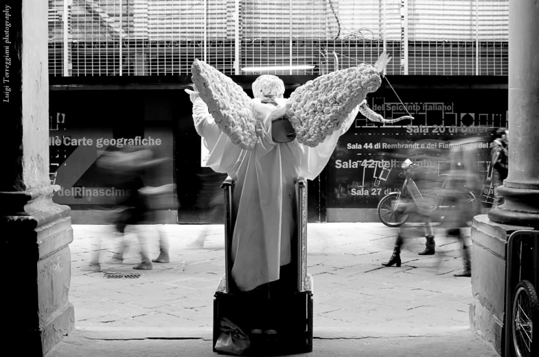 a statue of the artist with an angel wings on it