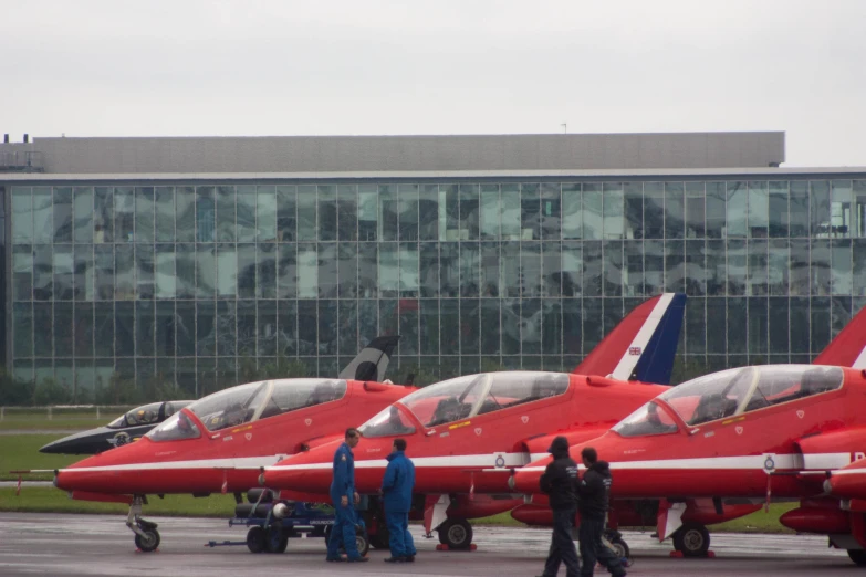 several jet planes parked next to each other