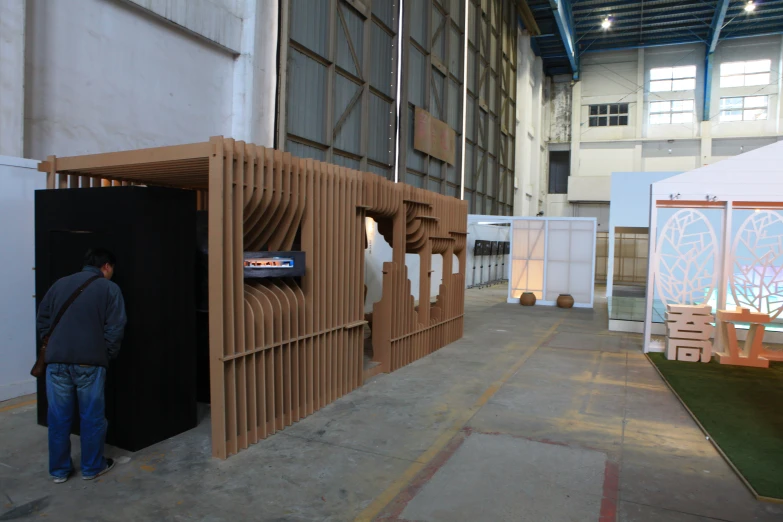 a man looks into the entrance of a large room