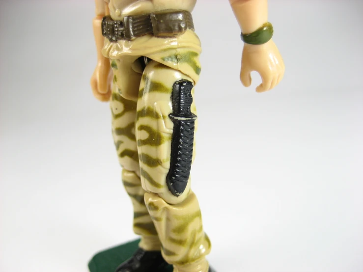 toy soldiers with weapon on stand pose for pograph