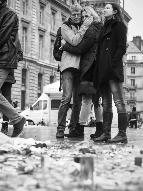 black and white image of a group of people on the street