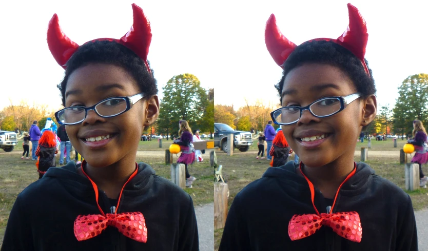 the boy is wearing the devil horns and glasses