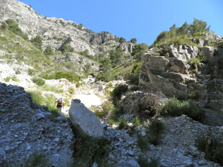 the rocks are in the foreground with people riding on them