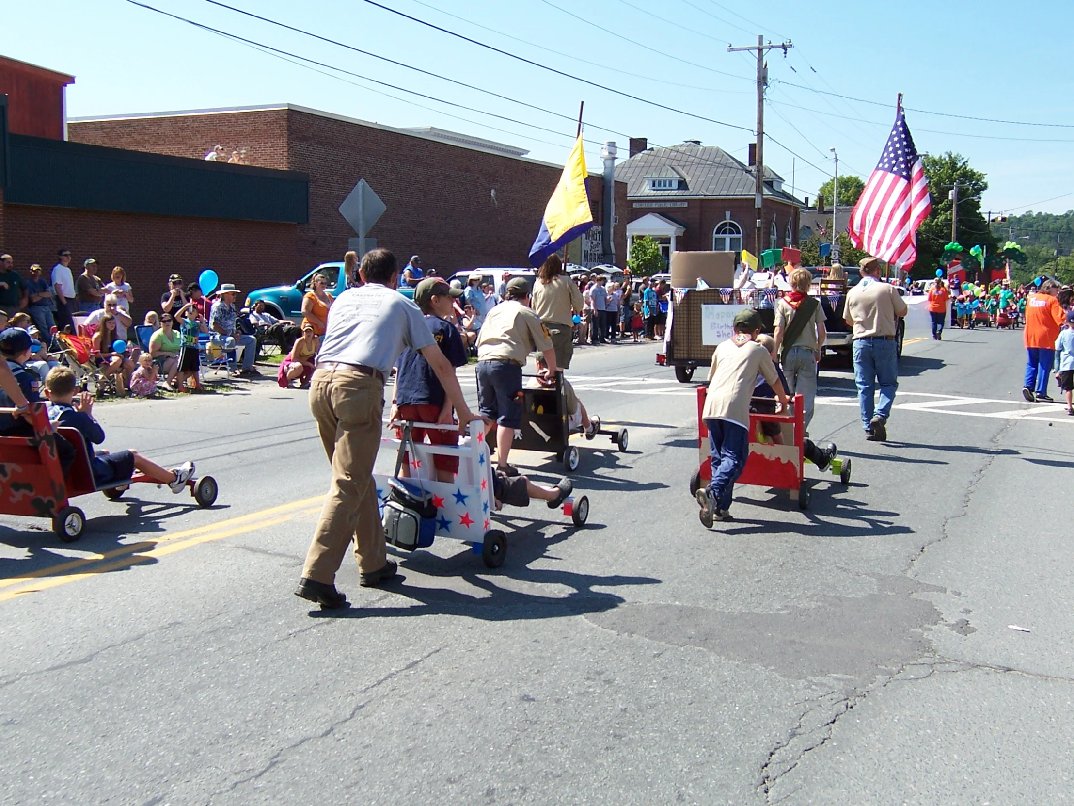 a group of people riding skateboards down a street