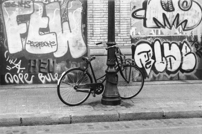 a bicycle parked on the side of a street