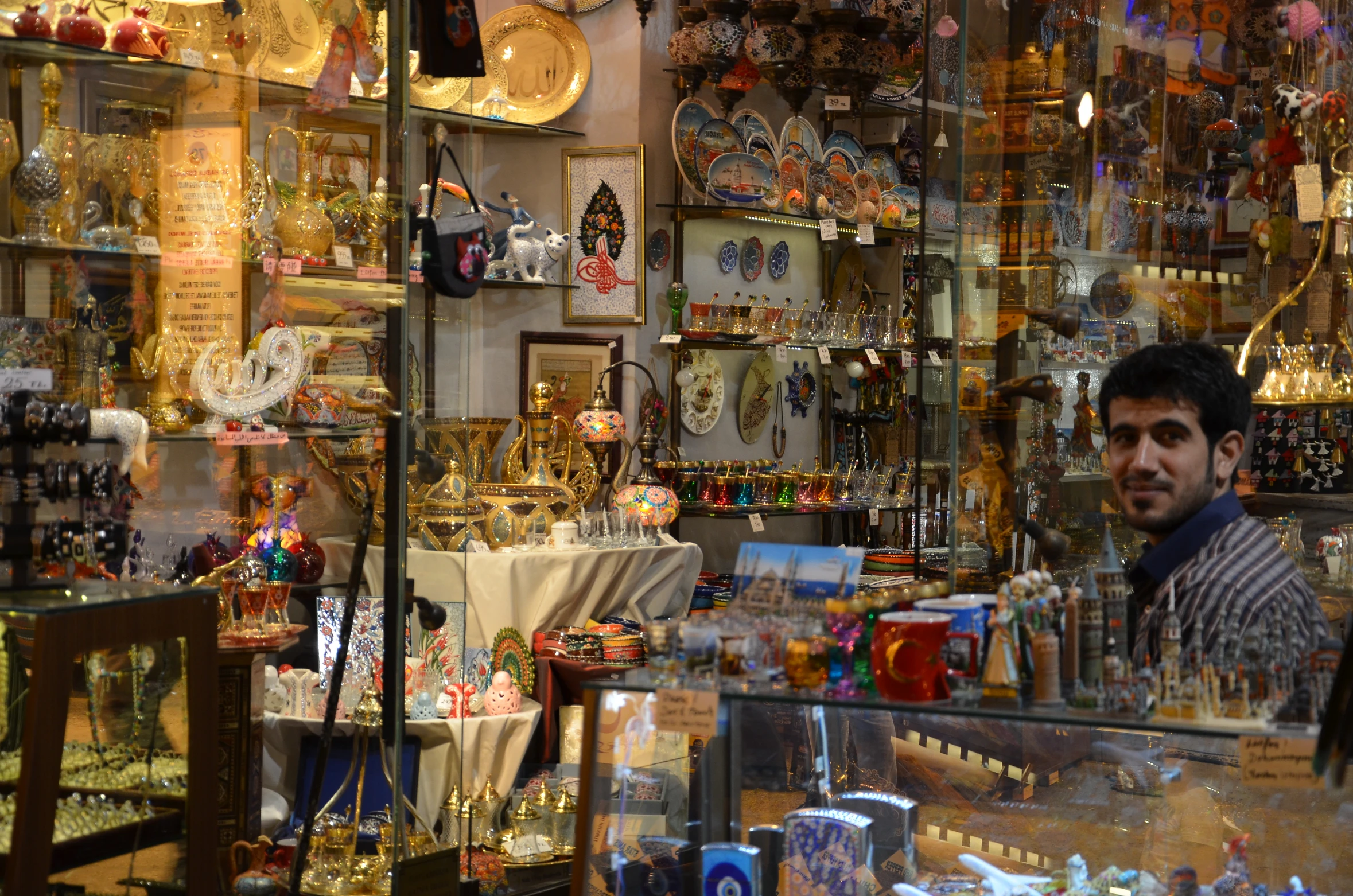 a man in a shop that sells different types of jeweles