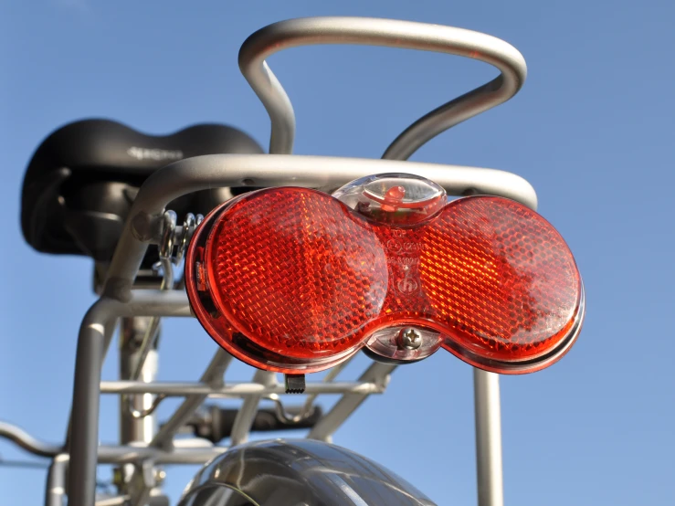 the top of a motor bike with two lights