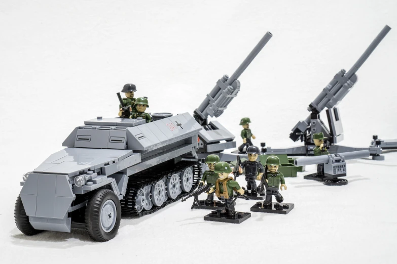 lego military figures in front of an armored vehicle