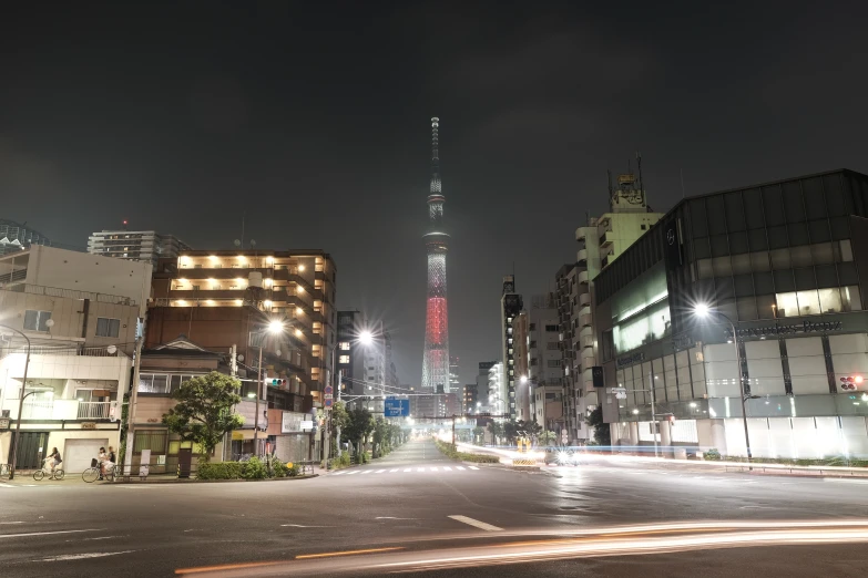 a city street with some cars passing by