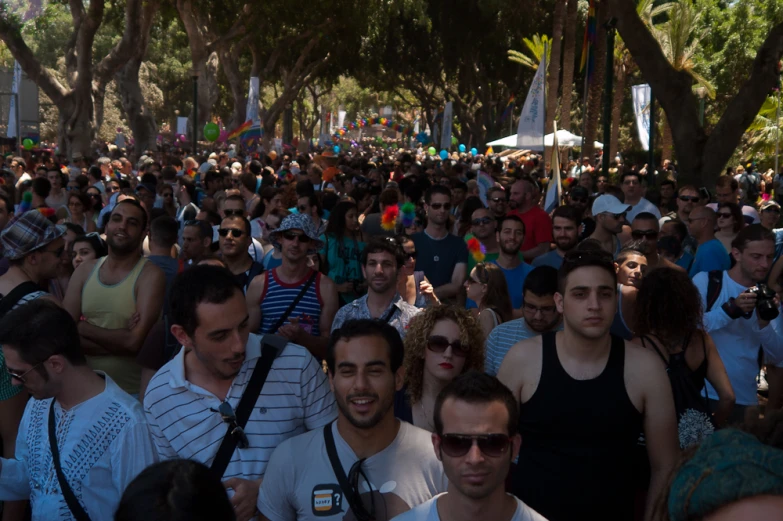 a huge crowd of people gathered in a street