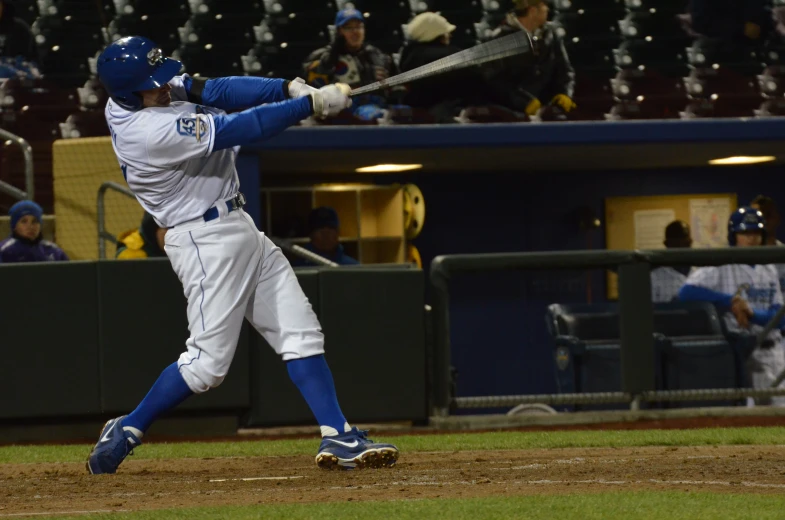 a baseball player getting ready to swing at a pitch