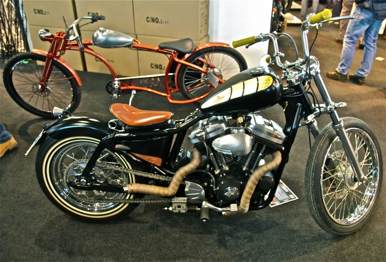 there is an old fashioned motorcycle on display