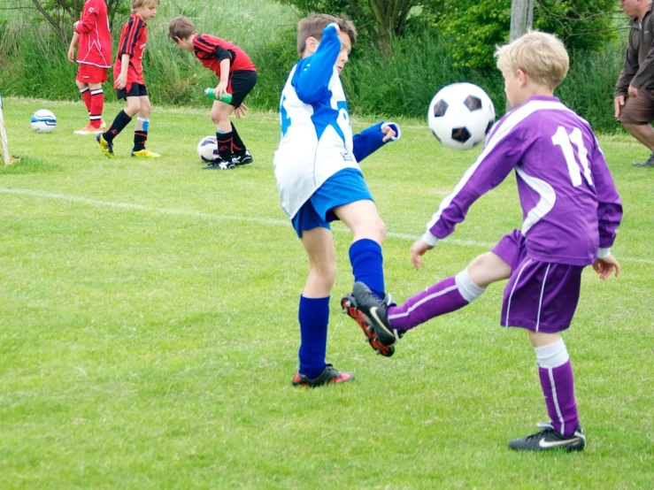 several s on a soccer field playing soccer