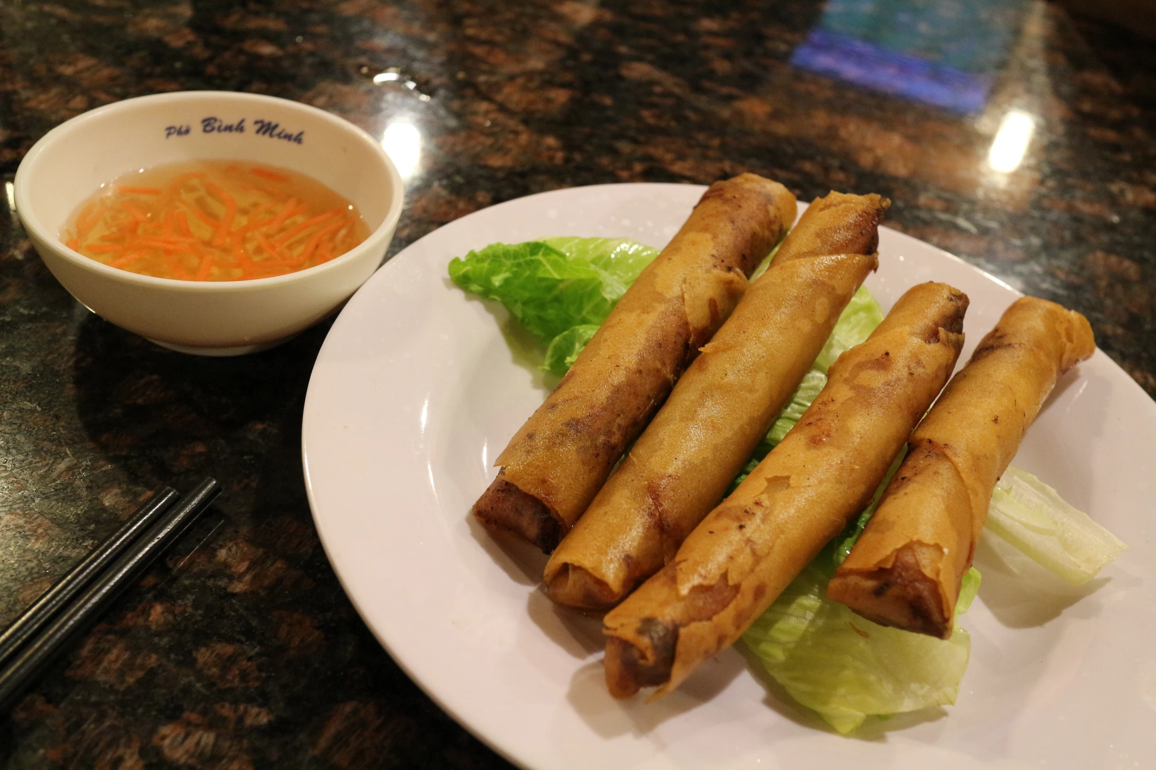 two plates with some food on a table