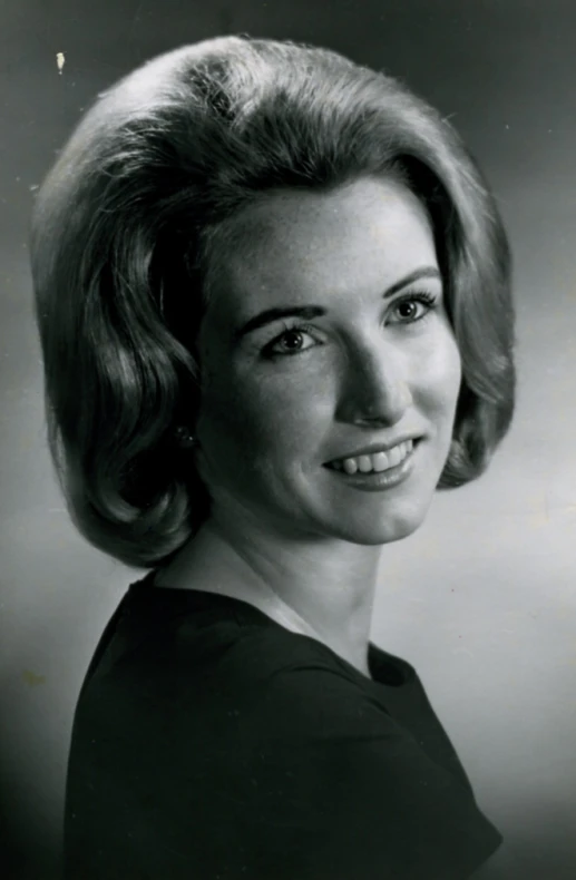 a black and white po of a woman smiling