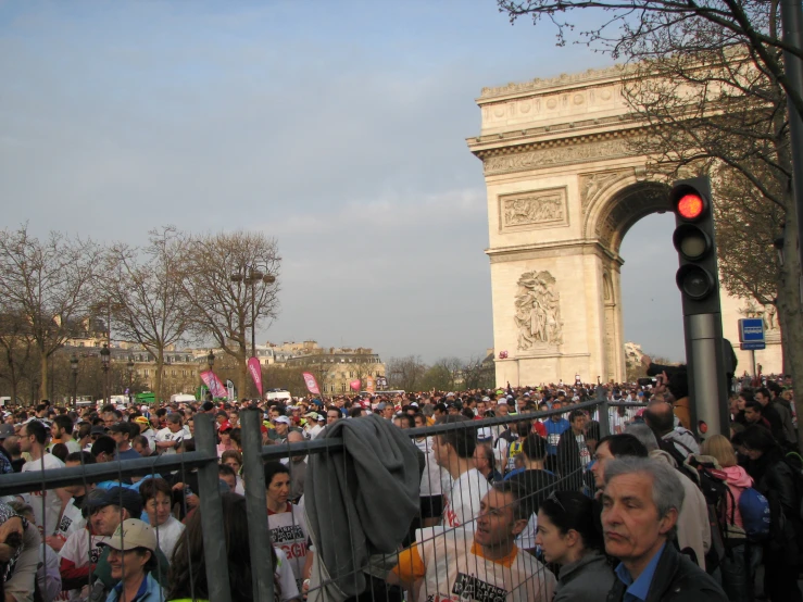 a large crowd in the city waiting for a political rally