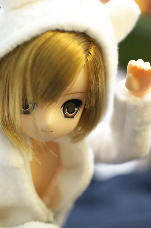a doll is wearing a white bunny suit