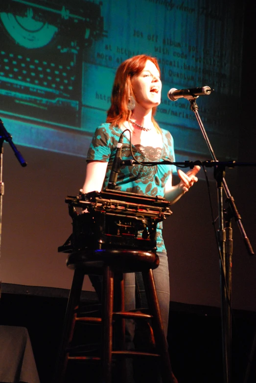 a person stands behind a microphone and sings