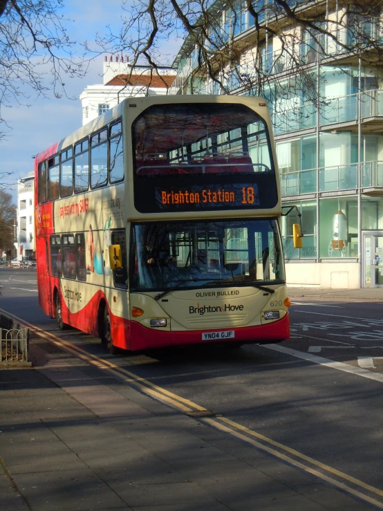 a double decker bus driving down the street