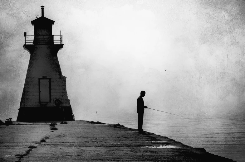 a person is flying a kite on a lighthouse