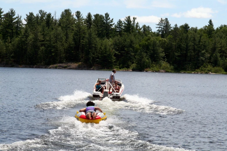 two people on jetski and one with a life jacket