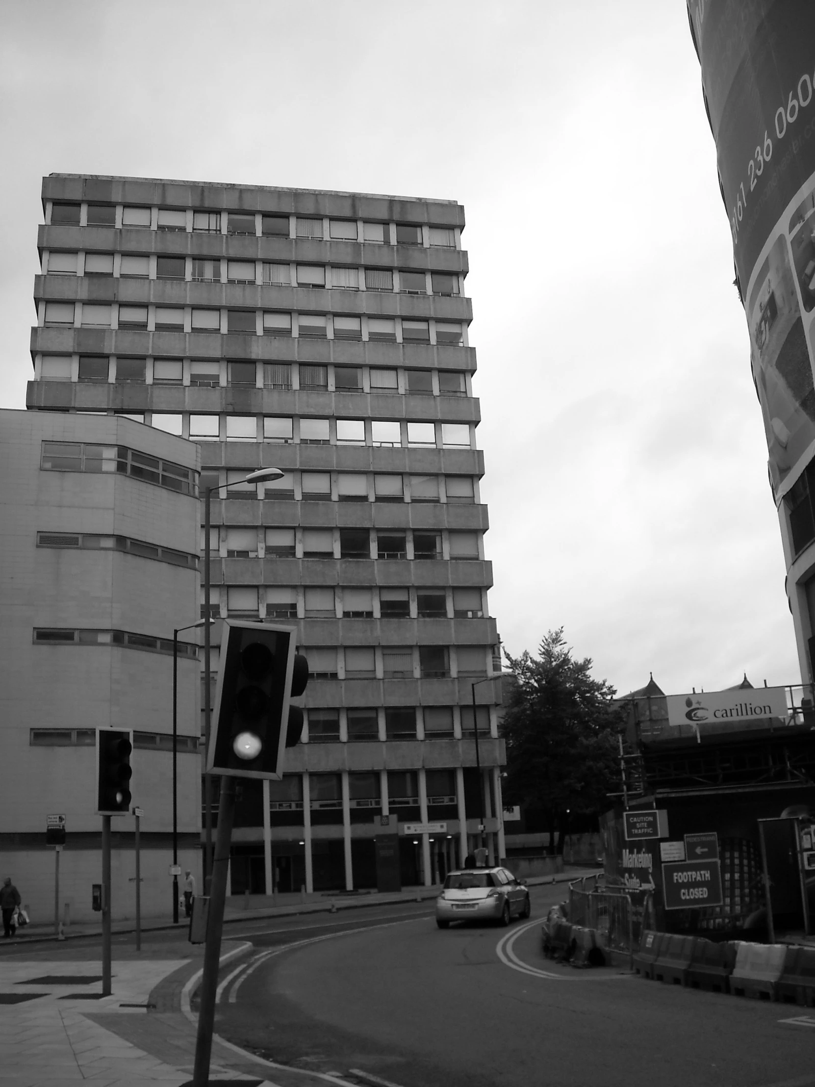 an urban street and a traffic light near a building