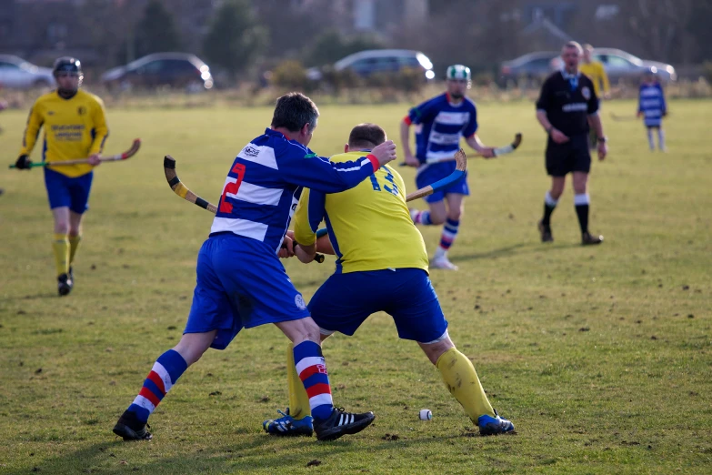 several people are playing soccer on a field