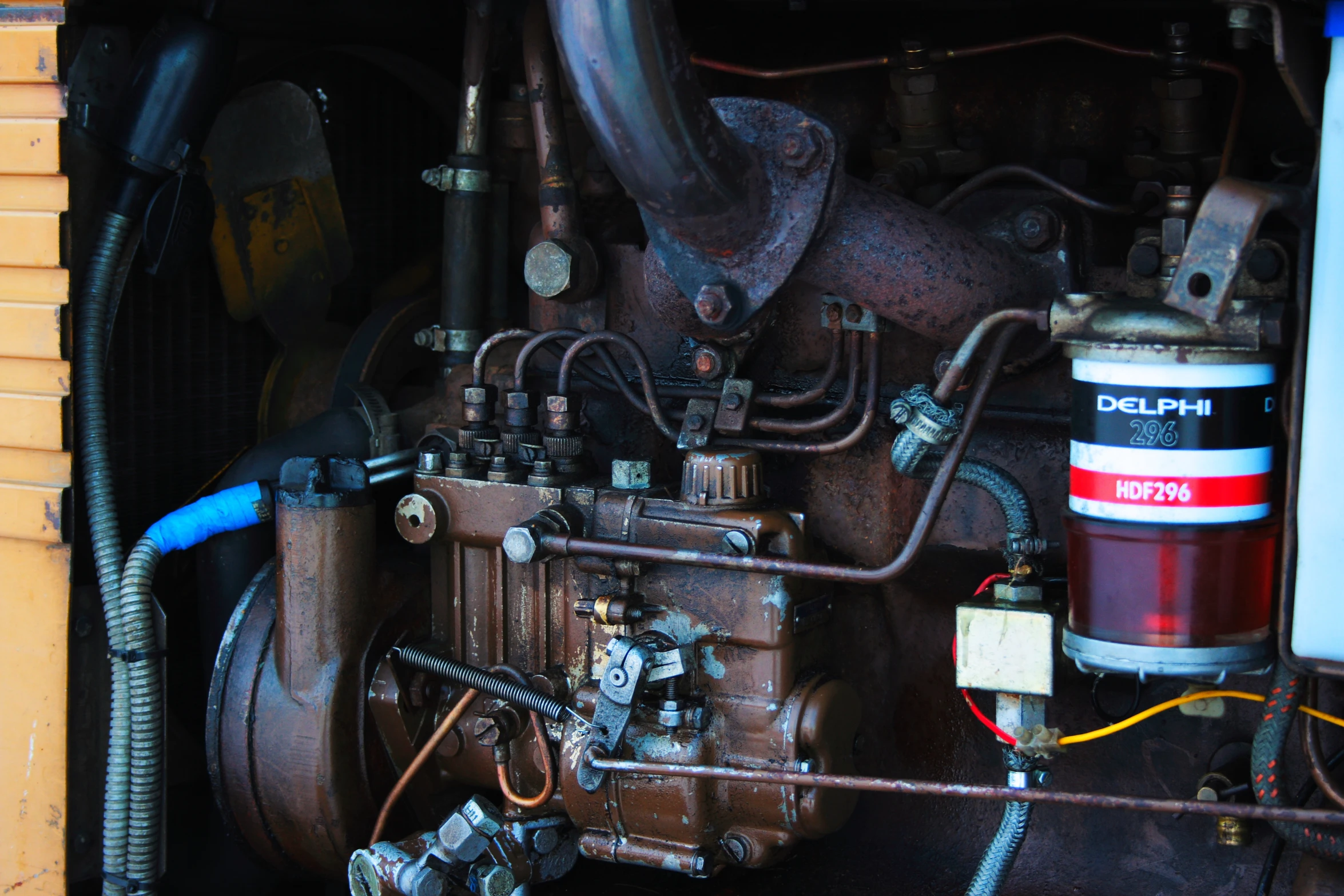 a large industrial engine in a building with wires and wires