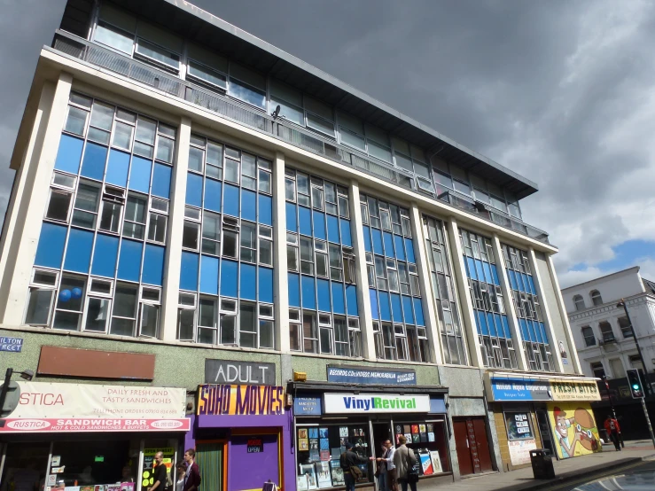 the outside of an office building next to a street