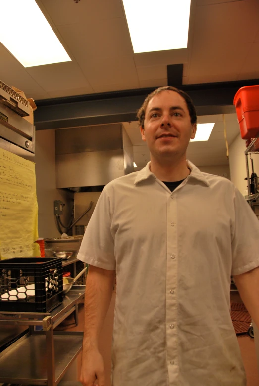 a man in a white shirt and some food