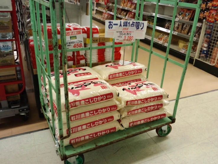 three pallets of rice sitting on a cart