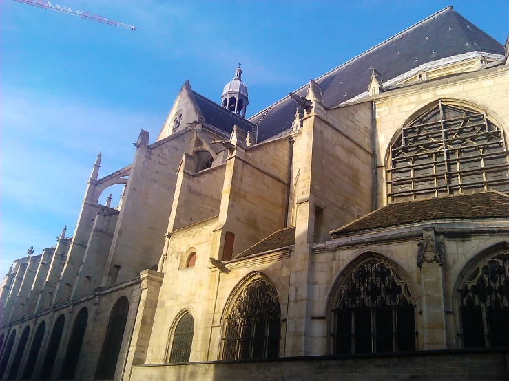 an old cathedral with arched windows and a steeple