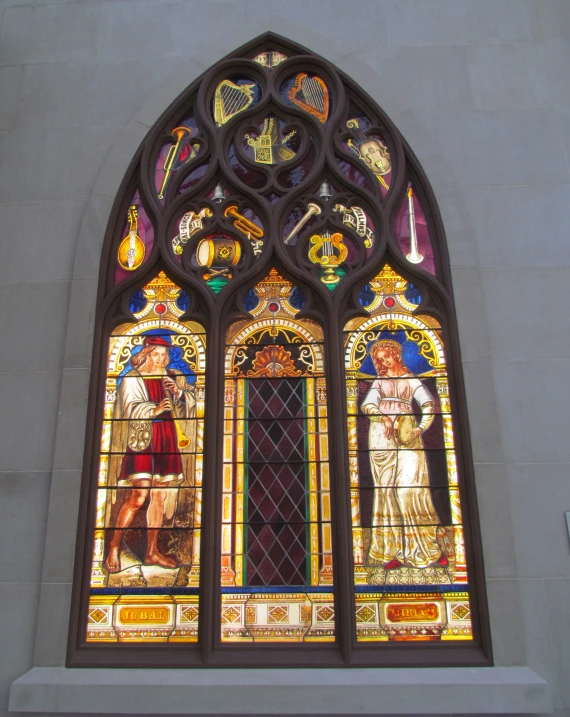 a very pretty stained glass window with angels