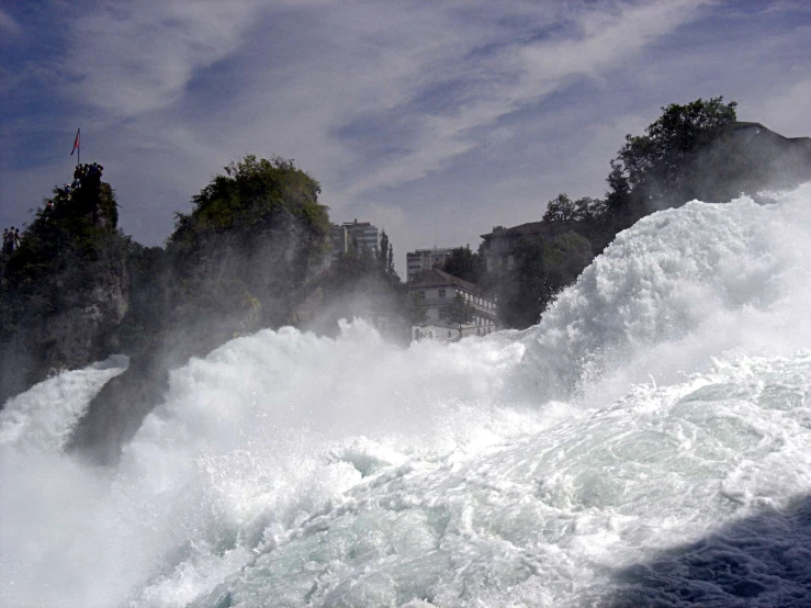 a large body of water with white foam