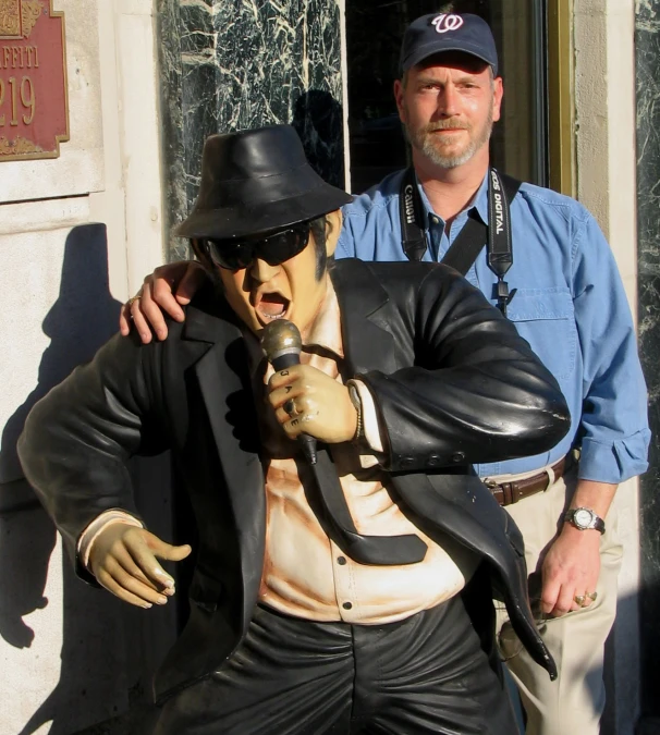 a sculpture of a man with a hat and glasses