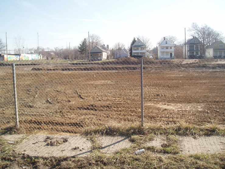 the bare dirt area where we are looking at houses and street