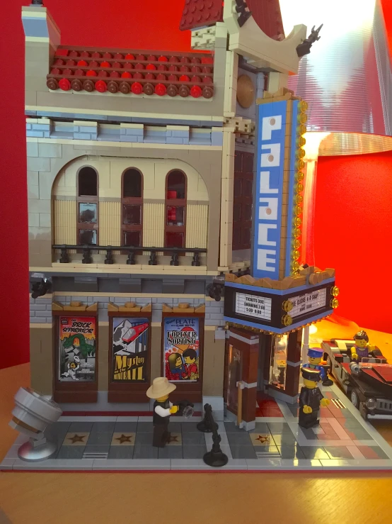 there is a lego building with a theater on it