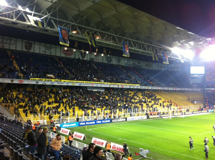 the crowd at the stadium watches their team