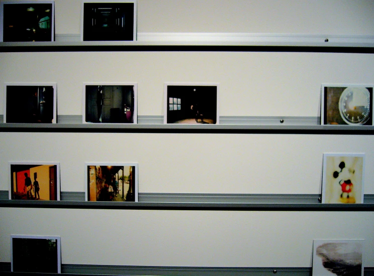 a book case full of books and dvds on shelves