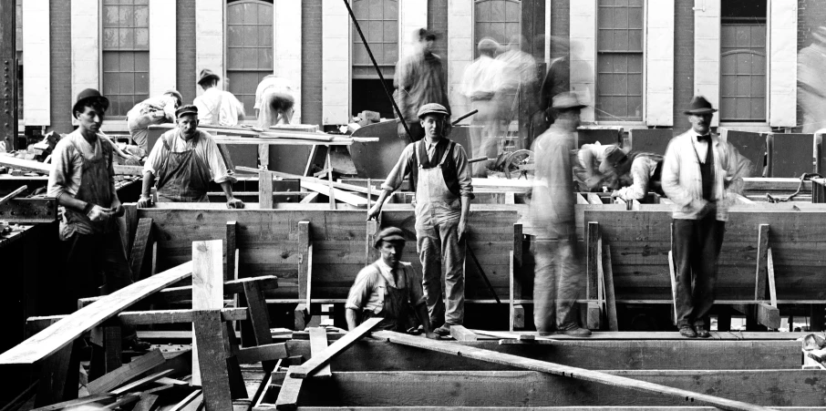 a group of people standing around a rail way