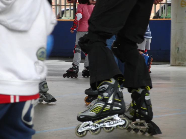 many feet with rollerblads all around them