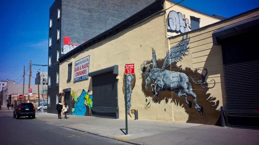 a large building with lots of graffiti on the side